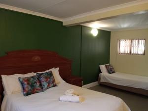 Katil atau katil-katil dalam bilik di Villa de la Rosa Klerksdorp