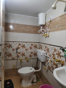 Koupelna v ubytování Abhya Home Stay