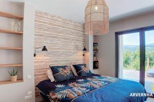 Ένα ή περισσότερα κρεβάτια σε δωμάτιο στο Villa Arvernha