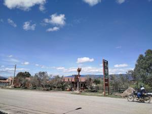 a person riding a motorcycle down a street at Apartamento ALTAMIRA de la VILLA de Leyva in Villa de Leyva