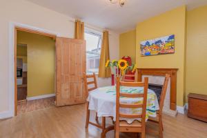 a dining room with a table and chairs at Monet's in Telford