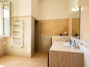 a bathroom with a sink and a shower at West Sicily - Villa with Garden and Parking in Marsala