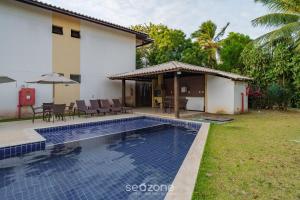 Πισίνα στο ή κοντά στο Apto confortável c/ piscina prox. a praia VRL0002