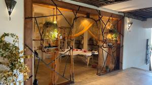 an open door to a room with a table at Basecamp Mafía Island in Utende
