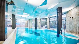 Bazén v ubytovaní VacationClub - Diune Hotel Apartament 115 alebo v jeho blízkosti