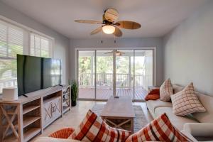 a living room with a flat screen tv and a couch at Cabana at the Golf Club - Monthly Rental in Key West