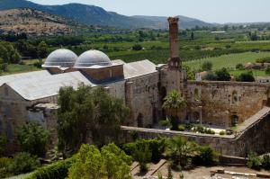 an old building with two domes on top of it at Sunset House in Selçuk