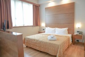 Posteľ alebo postele v izbe v ubytovaní Hotel Europa
