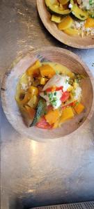 two plates of food sitting on a table at Hôtel Restaurant Les Touristes in Vals-les-Bains