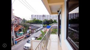 a balcony with a view of a city street at Junior apartment in Pattaya