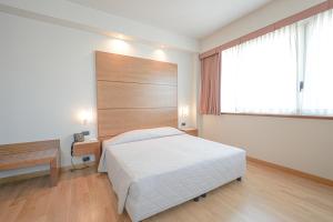 Posteľ alebo postele v izbe v ubytovaní Hotel Europa