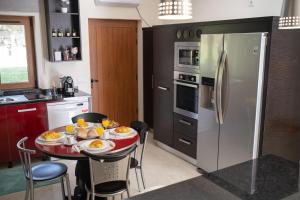 a kitchen with a table with plates of food on it at Casa do Casal do Douro in Marco de Canaveses