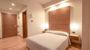 Posteľ alebo postele v izbe v ubytovaní Hotel Europa