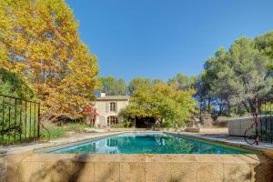 a swimming pool in the yard of a house at Mas Des Cigales Lambesc in Lambesc +34 photos