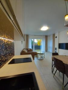 a living room with a couch and a table at SPA TOWN house II in Druskininkai