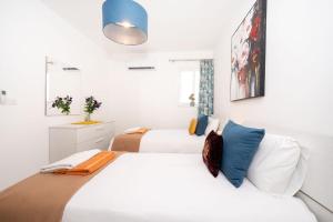 Letto o letti in una camera di Hillock Residence Apartments