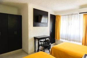 TV a/nebo společenská místnost v ubytování Hotel Antillano