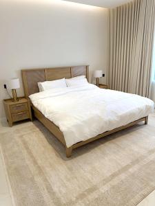 Postel nebo postele na pokoji v ubytování دانة هوم + 10 fotografií