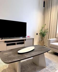 TV a/nebo společenská místnost v ubytování دانة هوم