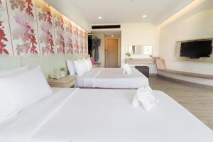 Ένα ή περισσότερα κρεβάτια σε δωμάτιο στο MATCHA SAMUI RESORT formerly Chaba Samui Resort