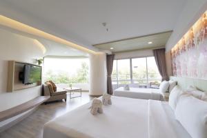 Ένα ή περισσότερα κρεβάτια σε δωμάτιο στο MATCHA SAMUI RESORT formerly Chaba Samui Resort