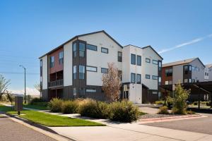 an apartment building on the side of a street at Cinnabar Suite - Mountain Views in Bozeman