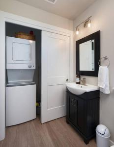 a bathroom with a sink and a white refrigerator at Cinnabar Suite - Mountain Views in Bozeman +12 photos