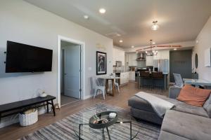 a living room with a couch and a table at Cinnabar Suite - Mountain Views in Bozeman