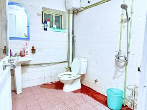a bathroom with a toilet and a sink at House with balcony,K Home 1,Old Quarter,3 mins to Hoankiem Lake in Hanoi +15 photos