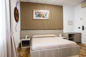 A bed or beds in a room at B&B Palazzo Storico Di Nicola
