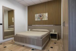 A bed or beds in a room at B&B Palazzo Storico Di Nicola