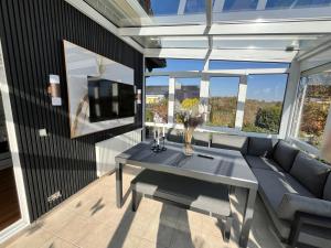 a living room with a couch and a table at Villa Altdorf in Ettenheim