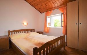 Ένα ή περισσότερα κρεβάτια σε δωμάτιο στο Apartments Loris