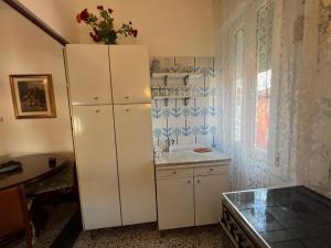 a kitchen with a white refrigerator and a sink at S Marco Apartments - Urban Boutique & Venice Link in Mestre