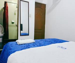 Postel nebo postele na pokoji v ubytování Hostal Wan Ka Trujillo + 3 fotografie