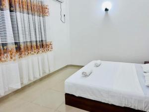 Postel nebo postele na pokoji v ubytování Namal Guest House