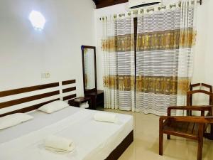 Postel nebo postele na pokoji v ubytování Namal Guest House