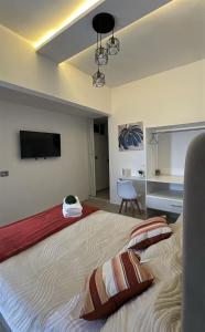 a bedroom with a large bed with a flat screen tv at DG Divine Garden Tabasco in Villahermosa +20 photos
