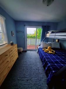 a bedroom with a bed with bananas on it at Pet friendly minutes to beach in Marlyn Manor