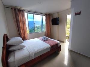Postel nebo postele na pokoji v ubytování Hotel kristal campestre