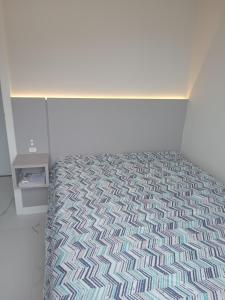 Postel nebo postele na pokoji v ubytování Apartamento com vista para montanha em Palmas 4