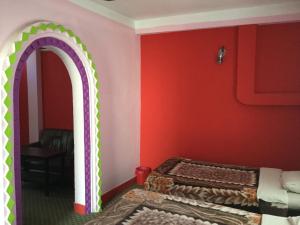 Letto o letti in una camera di Pashupati Darshan Hotel