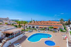 an aerial view of a resort with a swimming pool at Costa Adeje Heated Pool Marina Primavera in Adeje