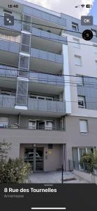 an apartment building with graffiti on the side of it at Chambre double privée in Annemasse