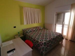 Postel nebo postele na pokoji v ubytování B&B Le Terrazze