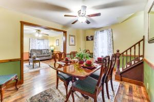 a dining room with a table and chairs and a ceiling fan at Grill, Dine and Relax Outside Home in Tyrone! in Tyrone