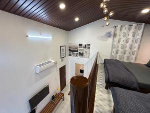 a bedroom with a bed and a tv in a room at Sharma nivas Yelagiri villa in Yelagiri
