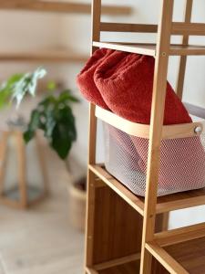 a basket of towels sitting on a shelf at Famma House in Capu Piscului