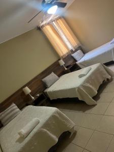 Cama ou camas em um quarto em Hotel El Huacachinero