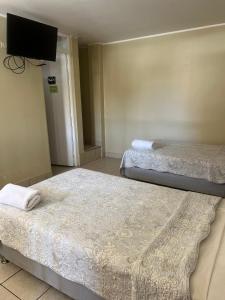 Cama ou camas em um quarto em Hotel El Huacachinero